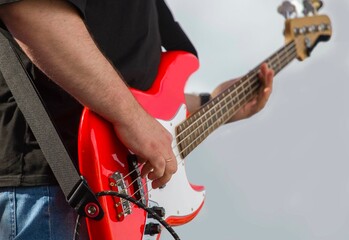 close-up of the hands of a musician playing an electric guitar