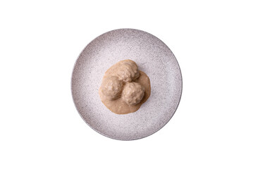 Delicious meatballs from minced chicken or turkey with sour cream sauce