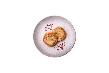 Delicious baked fish fillet with cheese, tomatoes, salt, spices and herbs