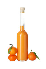 Bottle of tasty tangerine liqueur and fresh fruits isolated on white