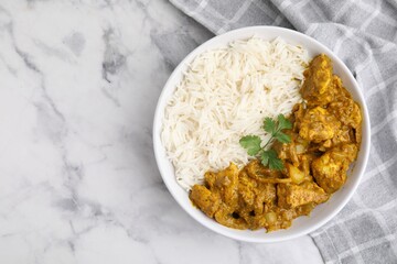 Delicious chicken curry with rice on white marble table, top view. Space for text