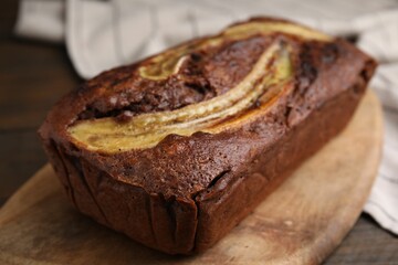 Delicious banana bread on wooden table, closeup
