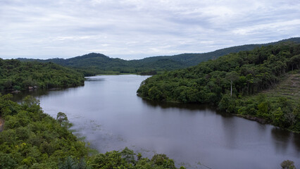 Obraz premium Aerial view of the lake in the mountainous area of South Kalimantan located in Sungai Dua village