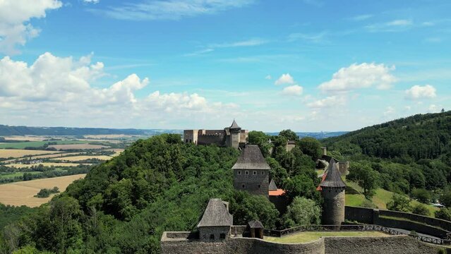 Aerial drone view of the landmark of Helfstyn Castle. Helftyn Castle overlooking the hills where the castle lies during a beautiful sunny day. Located in Czech republic