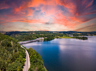 sunset over the poehl lake, vogtland east germany with dam