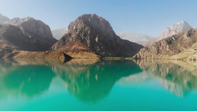 Aerial view Iskanderkul Lake, Fann mountains, Tajikistan, Central Asia.
Mountains and blue sky above
Iskanderkul (Iskander Kul) Lake.