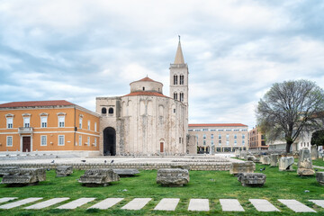 Fototapeta premium Amazing view with the beautiful old architecture of St. Donat church and Cathedral of St. Anastasia bell tower in the old town of Zadar on the coast of the Adriatic Sea, Croatia.