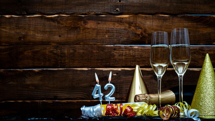 Solemn background for the anniversary with the number  42. Happy birthday background on brown...