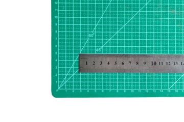 Green cutting mat with a ruler. Cutting concept. do it yourself concept.