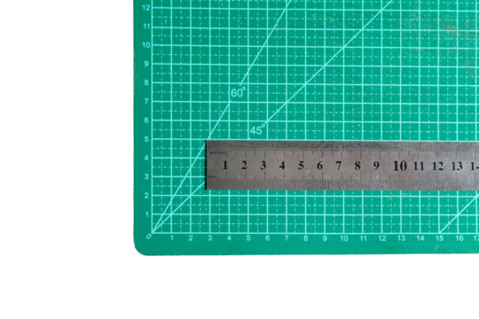 Green cutting mat with a ruler. Cutting concept. do it yourself concept.
