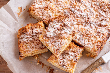 Streusel pie stuffed with jam on parchment