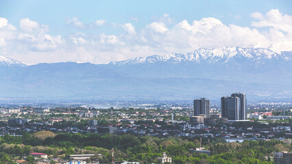 Tashkent, Uzbekistan. Panoramic top view to the part of the city of Tashkent from the Television Tower. Mountain, Chatkal Ran at background.