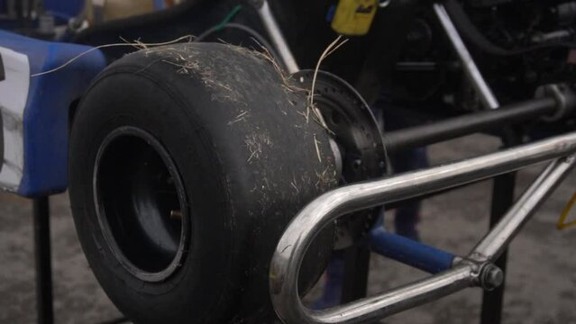 Preparing a racing kart car for the race. Spinning wheel close up