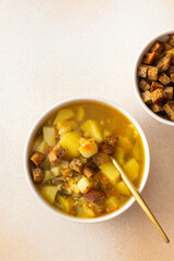 Pea soup with fried croutons, healthy bean soup, top view