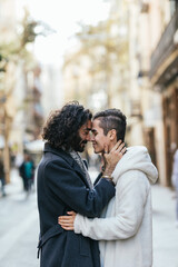 Gay couple in love in a tender moment on the street.