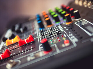Close-up of sound recording equipment knobs.Mixer control. Music engineer. Backstage controls on an...
