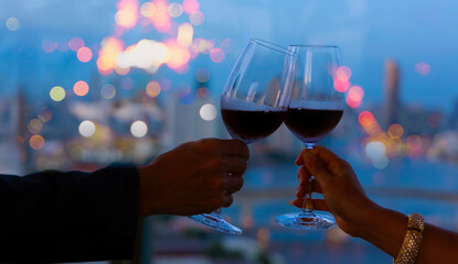 Hand of romantic couple or friendship which happy moment relaxing ,red,wineglass,celebration on the...