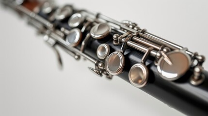 Fototapeta premium Close-up of a clarinet isolated on a white background, showcasing the exquisite details of this woodwind instrument in a stunning artistic perspective.