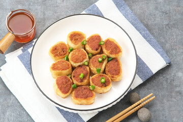 Gohyong or Ngo Hiang, made from minced chicken with flour, served with sour sauce
