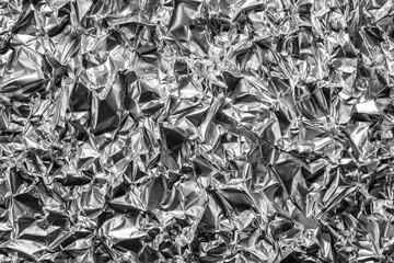 Crumpled shiny metal foil texture