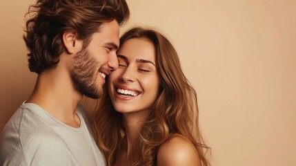 A joyful couple sharing a tender moment with the man kissing the woman's cheek both smiling and looking into each other's eyes.