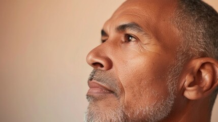 Obraz premium A close-up of a person's face focusing on the profile view from the nose down to the ear.