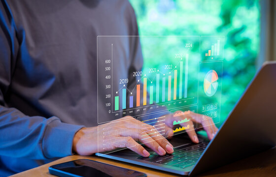 Businessman or Analyst using KPI dashboard on screen with business analytics and data management system of the company. Corporate strategy for finance, market, Financial data report graph concept.