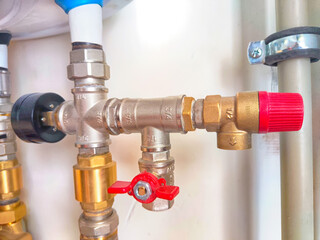 Close-Up of Domestic Water Shut-Off Valves. detailed view of the copper piping and two types of...