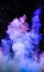 Explosion of multicolored blue purple powder on a black background