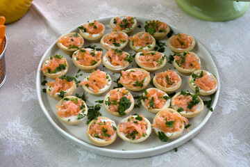 Delicious salmon and cheese canapés on a birthday party table. An irresistible temptation for celebratory moments.