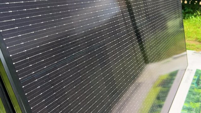 Close-up new solar panels ready for installation. Renewable energy technology, green living, and the implementation of solar power in residential areas.