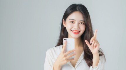 Beautiful Asian woman holding smartphone