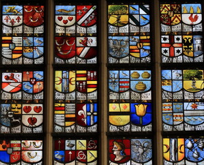 Historical Stained Glass Window Detail at the Oude Kerk Church in Amsterdam, Netherlands