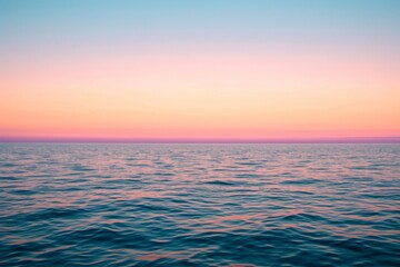 Naklejka na ściany i meble Soft pastel sunset, blending hues, over calm ocean horizon