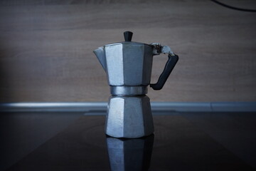 An old coffee maker on the stove
