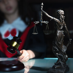 Humorous portrait of serious female judge (lawyer) makes the decision.