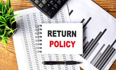RETURN POLICY text on a notebook with chart and calculator