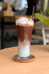 Chocolate mint latte with iced and whipping cream on top. Mint Choc is a nickname of drink.
