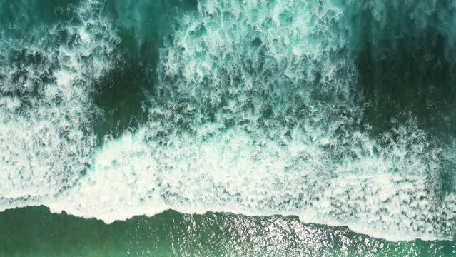 Breathtaking aerial view of the slow motion of the ocean waves.