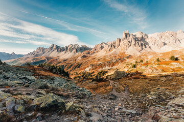 French Alps landscape of rocky Massif Des Cerces with Main De Crepin peak on wilderness in autumn...