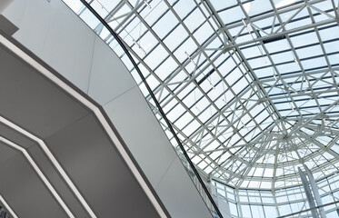 Fototapeta premium Lights and ventilation system in long line on ceiling of the industrial building. Exhibition Hall. Ceiling factory construction