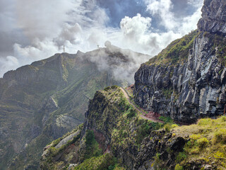 Pico do Arieiro beautiful mountain hiking trail. Rocks and cloudy sky in Madeira island, Portugal