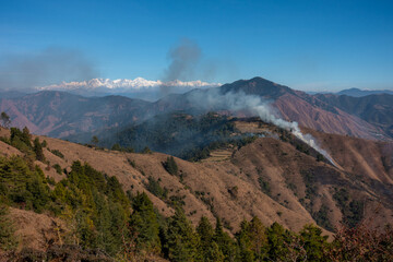 Summertime mountain wildfires engulf the Upper Himalayan terrain of Uttarakhand in the Tehri Garhwal region, India