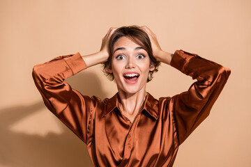 Photo of funny funky woman wear silky blouse open mouth arms head isolated beige color background