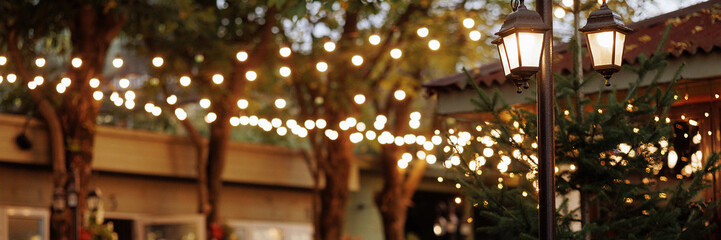 Illuminated restaurant entrance during a wedding. Romantic and welcoming atmosphere. Concept:...