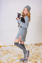 Pretty woman with funny pet. Playful lady posing in studio.