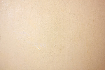 Plaster. Authentic texture, plastered wall surface, copy space, background. Orange, beige plastered...