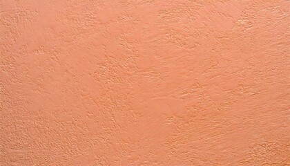 Fototapeta premium Background of embossed texture in peach fuzz color.