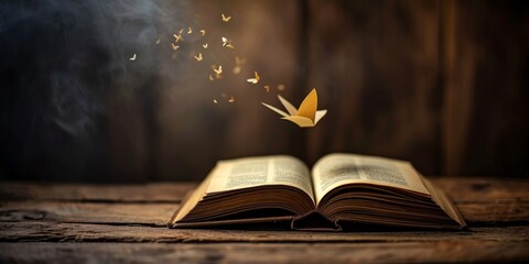 an open book with a bookmark flying out of it.