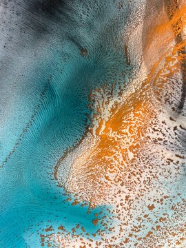 Abstract fluid art in green and turquoise tones. Hand-made with alcohol ink. Features organic flowing shapes. No real property or natural materials depicted.
